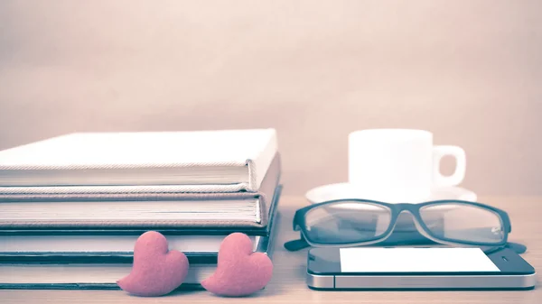 coffee,phone,eyeglasses,stack of book and heart