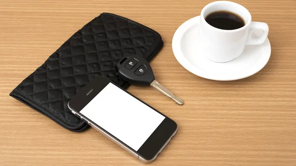 Coffee cup with phone car key and wallet — Stock Photo, Image