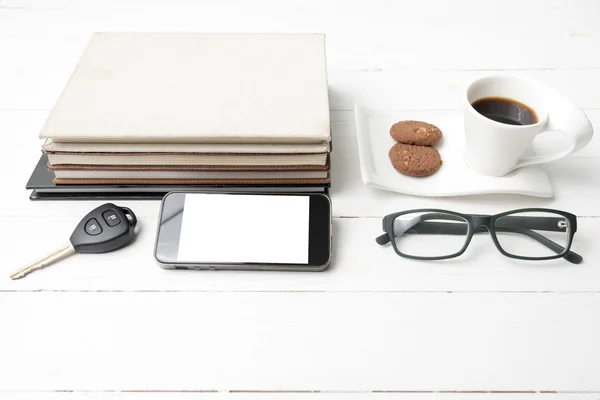 Coffee cup with cookie,phone,stack of book and car key — Stock Photo, Image