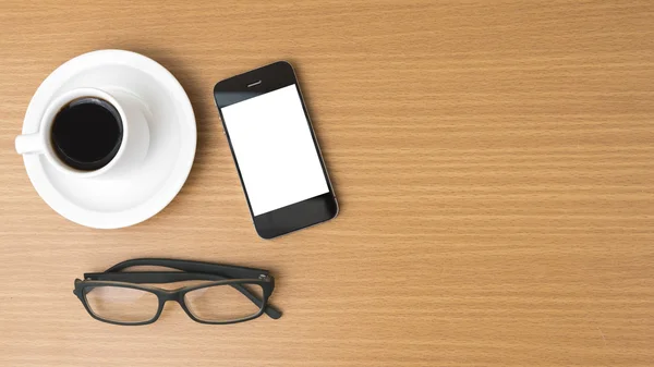 Tasse de café et téléphone et lunettes — Photo