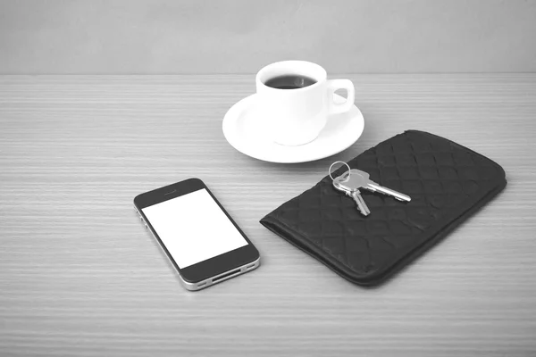 coffee phone key and wallet