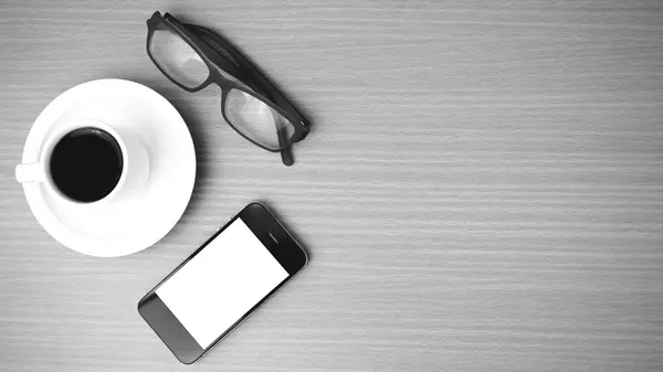 Coffee cup and phone and eyeglasses — Stock Photo, Image