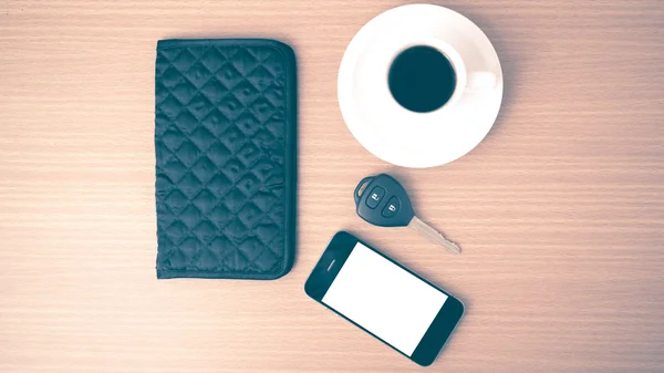 Coffee cup with phone car key and wallet — Stock Photo, Image