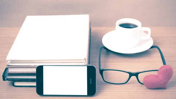 coffee,phone,eyeglasses,stack of book and heart