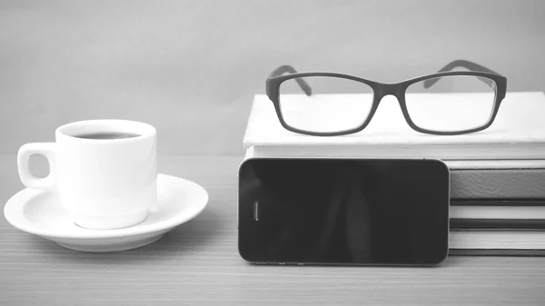 coffee,phone,stack of book and eyeglasses
