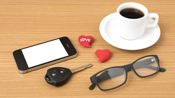 coffee,phone,eyeglasses,car key and heart