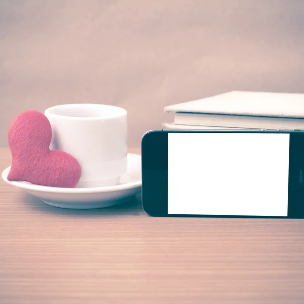 coffee,phone,stack of book and heart