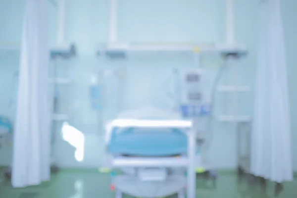 Fundo médico desfocado com cama de hospital — Fotografia de Stock