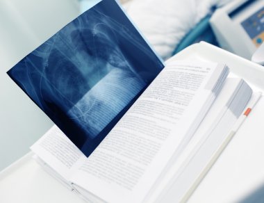 Book with an X-ray image as a bookmark in hospital, concept of t clipart