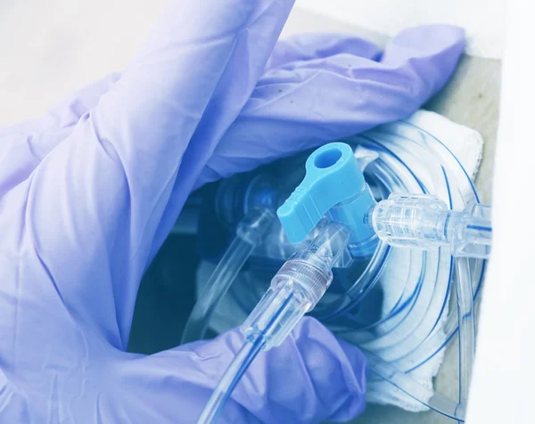 Nurse sets catheter to a patient — Stock Photo, Image