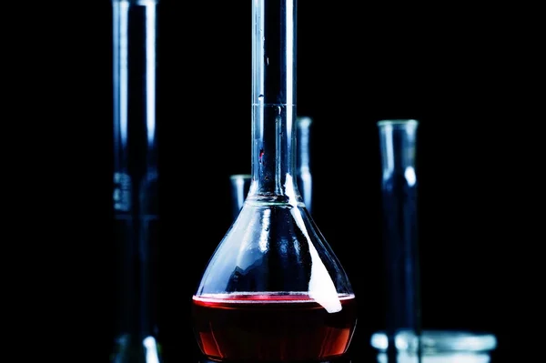 Red liquid in chemical beaker — Stock Photo, Image