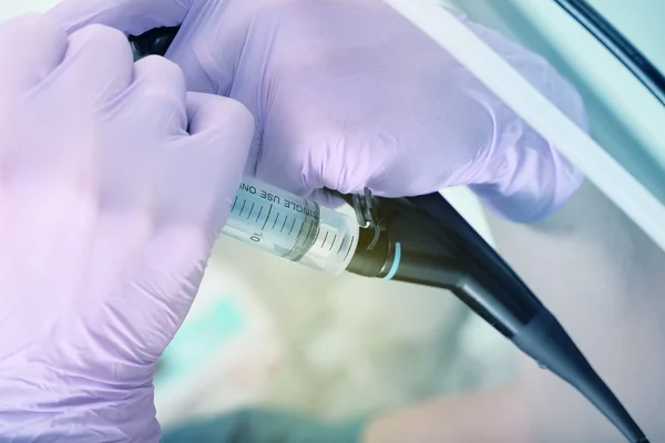 Doctor carries a medical operation using an endoscope — Stock Photo, Image