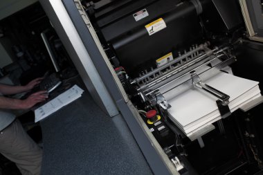Digital offset press in work process clipart