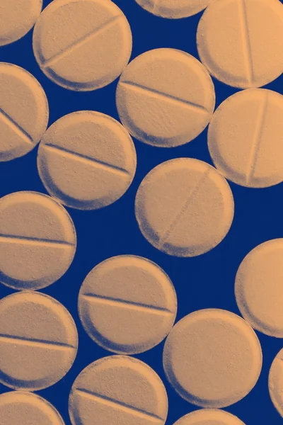 Strewn pills on dark background — Stock Photo, Image