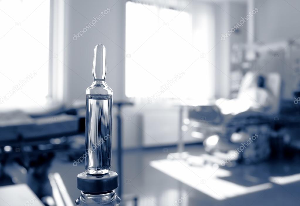 Ampoule in the ward with patients. Symbolic, sombre monochrome p