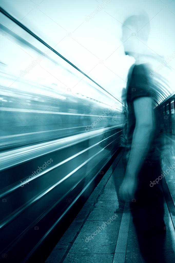 Man in front of a subway train 