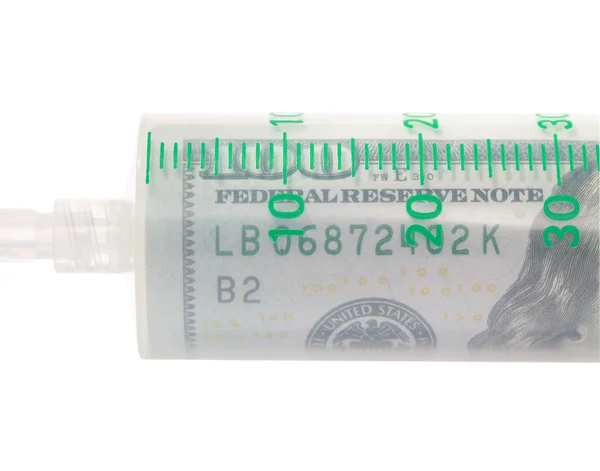 Lékařská stříkačka naplněná dolarů, koncept placených lékařských ser — Stock fotografie