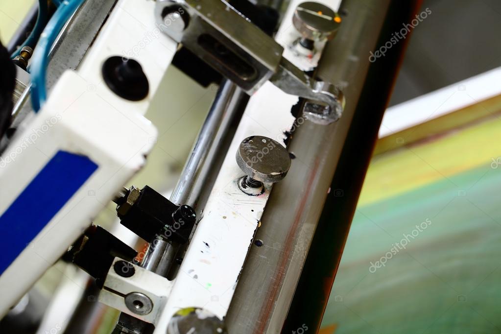 Detail of silk screen printing machine in the workshop