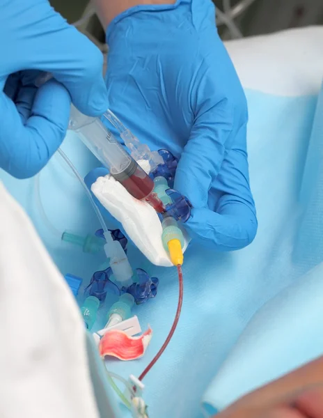 Doctor takes a blood sample from the patient — Stock Photo, Image