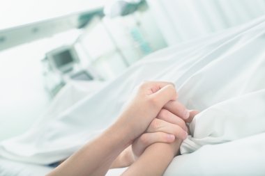 Gentle touch in a hospital ward clipart