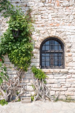 Old wooden window on stonewall, Balchik, Bulgaria clipart