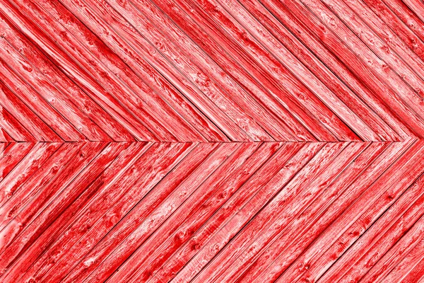 빨간색 배경은 널빤지들이 각도를 이루며 만들어 있습니다 — 스톡 사진