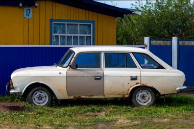 Car is a Soviet Moskvich, Izh Kombi. Bashkortostan, Russia - 12 June, 2021.