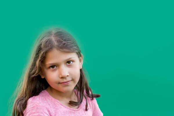 Girl Loose Hair Uniform Green Background Copy Space Front View — Stock Photo, Image