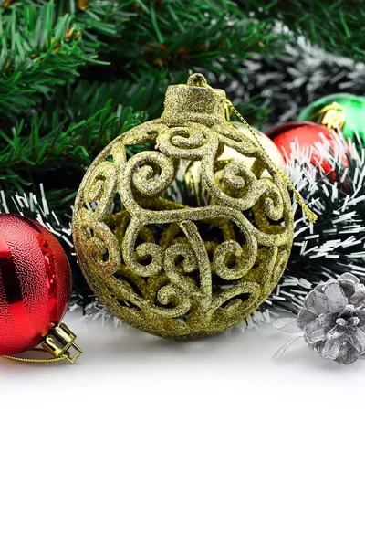 Christmas background with a golden ornament and decorations — Stock Photo, Image