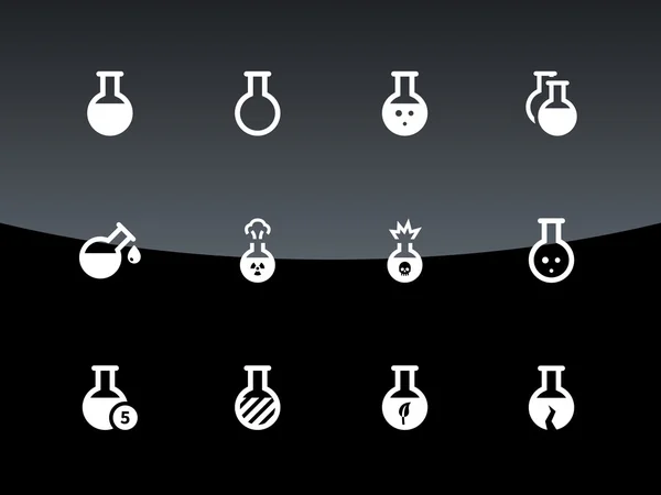 Iconos de bombilla de laboratorio sobre fondo negro . — Archivo Imágenes Vectoriales