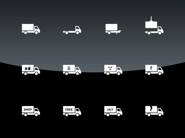 Піктограми доставки та вантажівок на чорному тлі . — стоковий вектор