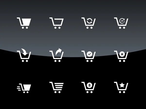 Iconos de carrito de compras sobre fondo negro . — Vector de stock