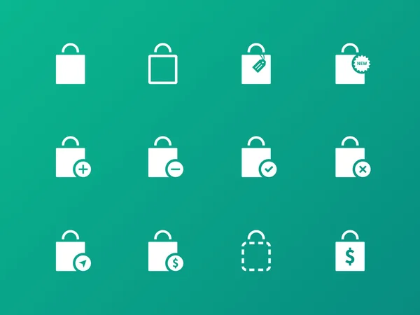Nákupní taška ikony na zeleném pozadí. — Stockový vektor
