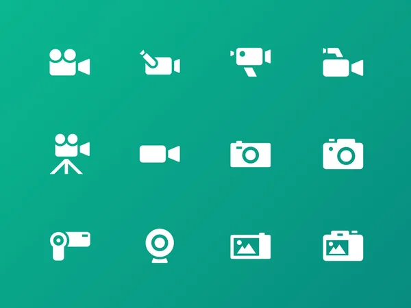 Iconos de cámara sobre fondo verde . — Vector de stock