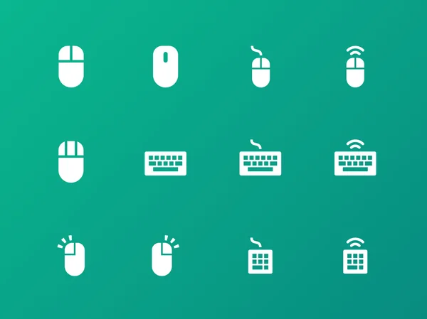 Mus och tangentbord ikoner på grön bakgrund. — Stock vektor