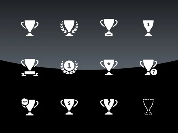 Premios e iconos de copa sobre fondo negro . — Vector de stock