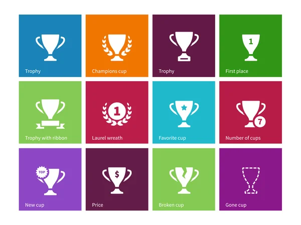 Trophy cup icons on color background. — Stock Vector