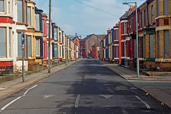 A street of boarded up derelict houses awaiting regeneration in Liverpool UK — Stock Photo, Image