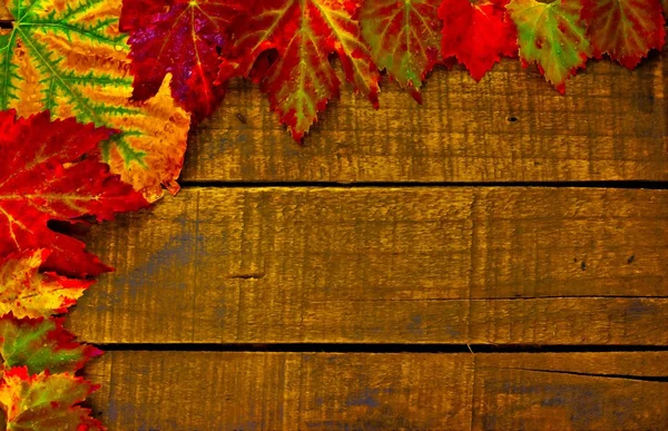 Digital painting of colorful autumn leaves on a wooden background — Stock Photo, Image