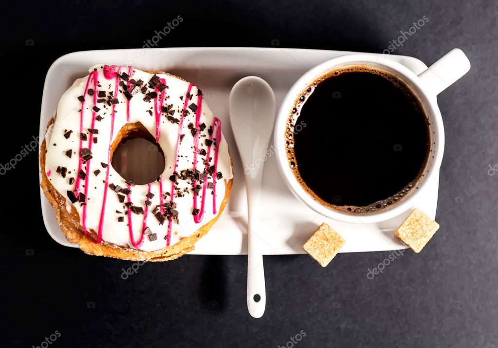 Donut and cup of coffee .Top view
