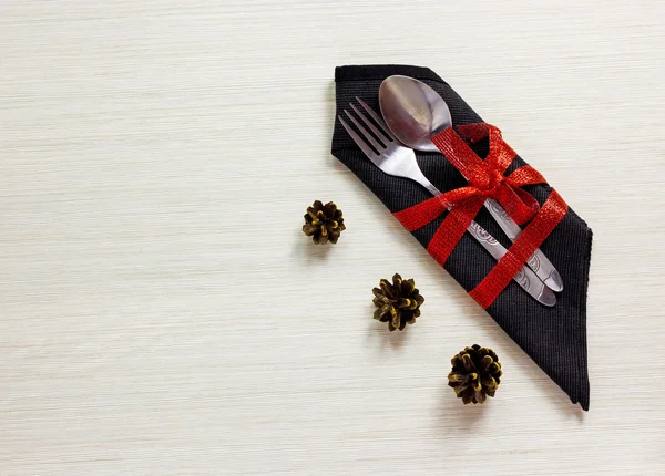 Silverware with fir cones on white wooden background.Christmas t — 图库照片