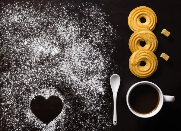 Minimalist breakfast with coffee, biscuits, brown sugar cubes, a