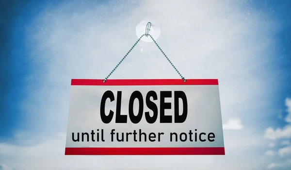 Closed businesses until further notice for COVID-19 , closure sign hanging on storefront window. Government shutdown of restaurants, stores, non essential services leading to bankruptcy unemployment