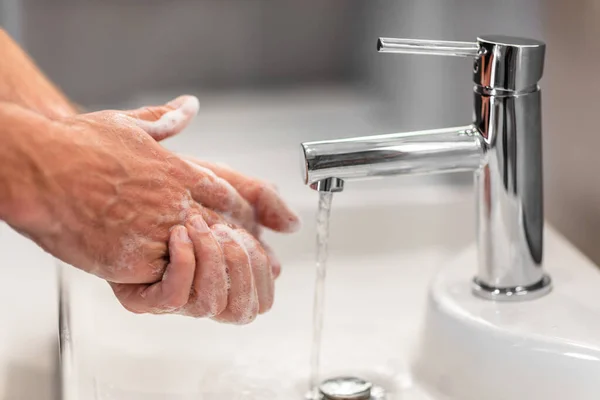 Coronavirus virus spreading prevention wash hands with soap rubbing nails and fingers washing frequently with running water or using hand sanitizer gel — Stock Photo, Image