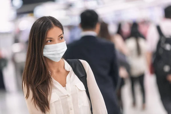 Virus mask Asian woman travel wearing face protection in prevention for coronavirus in China. Lady walking in public space bus station or airport — Stock Photo, Image