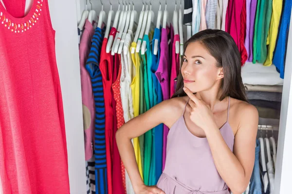 Home closet clothing rack girl thinking of outfit — Stock Photo, Image