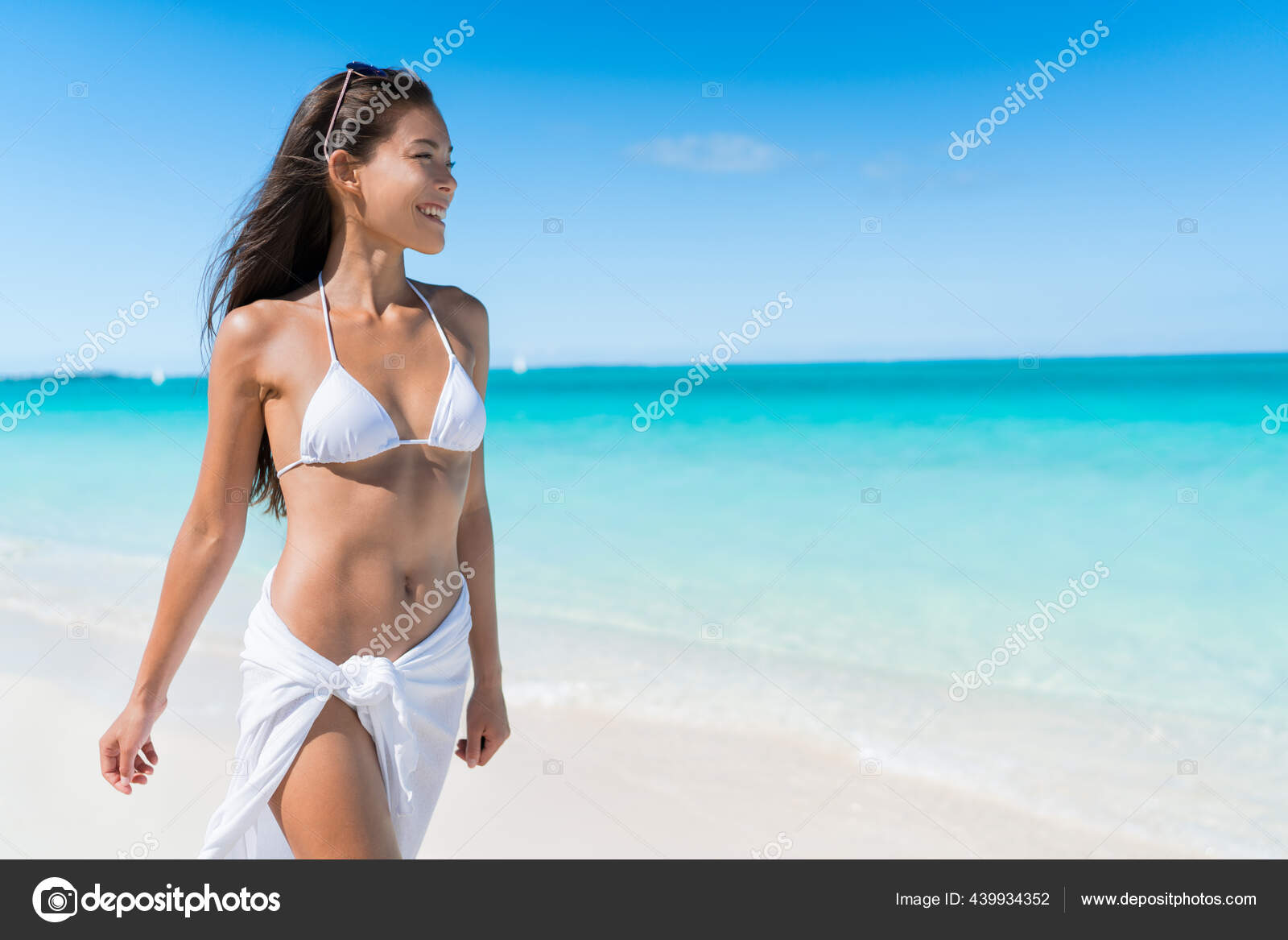 Asian bikini girl walking on beach summer vacation Stock Photo by ©Maridav  439934352