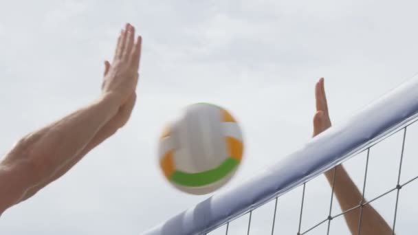 Beach volleyball net closeup spiking and blocking — Stock Video