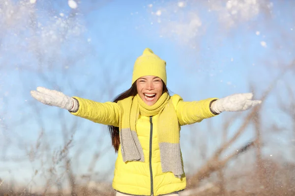 Winter fun girl throwing snow playing outside — Stock Photo, Image