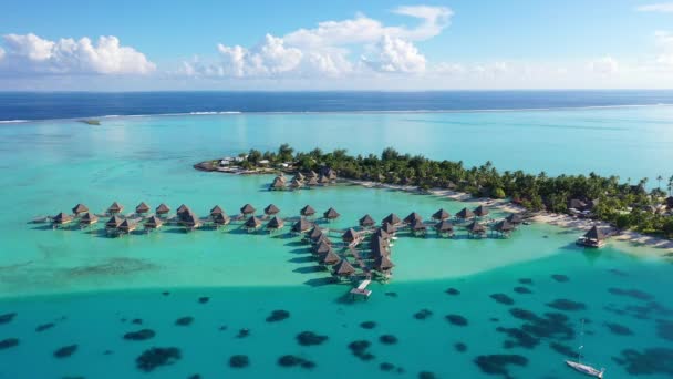 Travel vacation paradise aerial video with overwater bungalows in coral reef sea — Stock Video